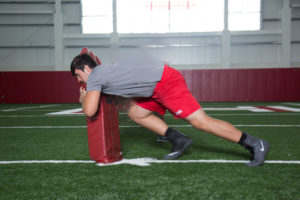 High School football player practicing fight to connect.
