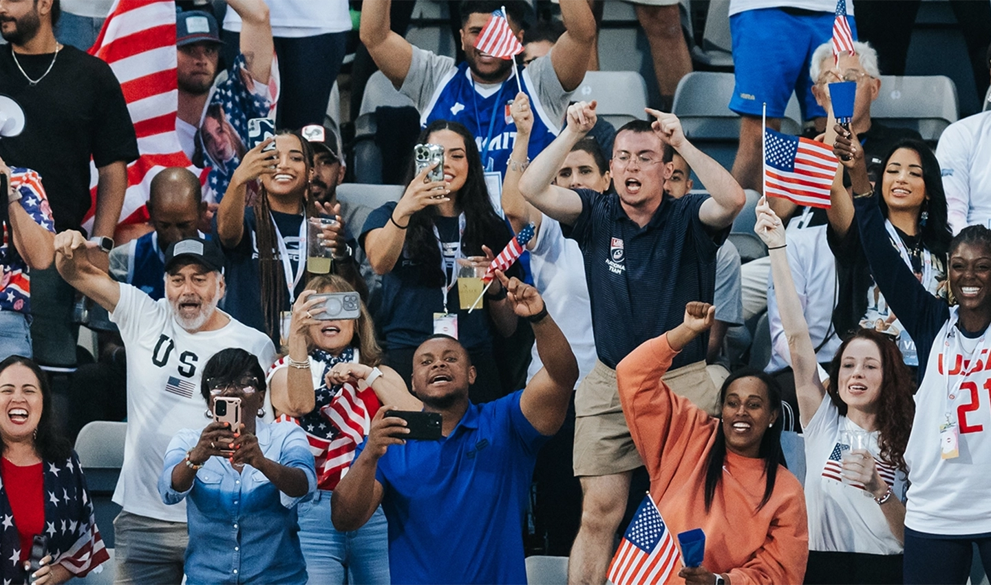 Fans cheering on TEAM USA FOOTBALL® during a flag football game.